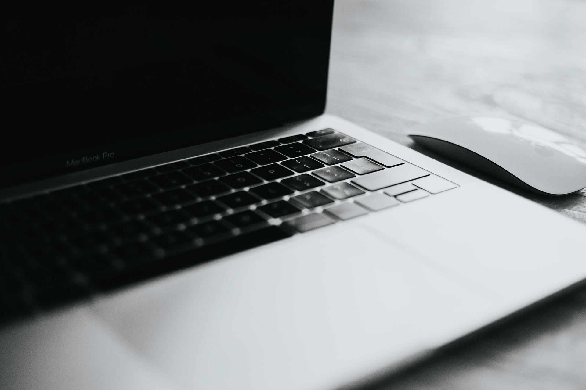 a close up of an open laptop computer sitting on top of a table